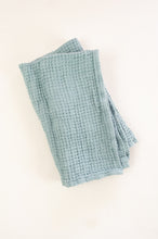 Load image into Gallery viewer, Waffle weave pure linen hand towel, made in Lithuania. In steel blue.