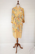 Load image into Gallery viewer, 100% fine cotton voile kimono gown, screen printed by hand, peony floral print in shades of green, white, orange and grey on a butter yellow background, contrast trim. Ethically made.