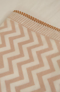 Soft cotton muslin layered Queen King bed quilt summer blanket in white and mustard chevron pattern.