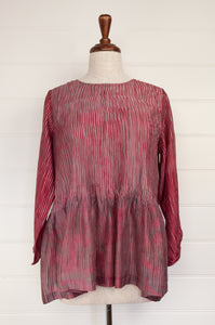 Juniper Hearth silk shibori Asha top with pin tucked bodice and long sleeves in deep raspberry red with pewter grey accents.