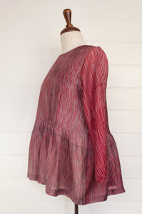 Juniper Hearth silk shibori Asha top with pin tucked bodice and long sleeves in deep raspberry red with pewter grey accents.
