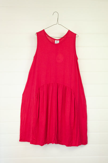 Valia Marissa dress in cotton knit, raspberry red. Sleeveless with round neck and dropped circle skirt, side pockets.