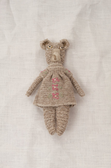 Sophie Digard crochet teddy bear, Pippa - oatmeal wool with matching dress featuring rose pink flowers.