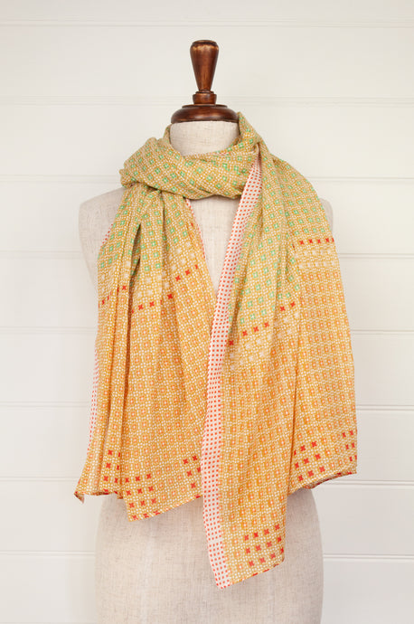 Anna Kaszer fine cotton voile scarf, geometric pattern in pale orange, aqua, red geometric design.