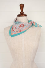 Load image into Gallery viewer, Anna Kaszer carré fine cotton neck square scarf, subtle fine geometric pattern in aqua and coral red, overlaid with tiny flowers.