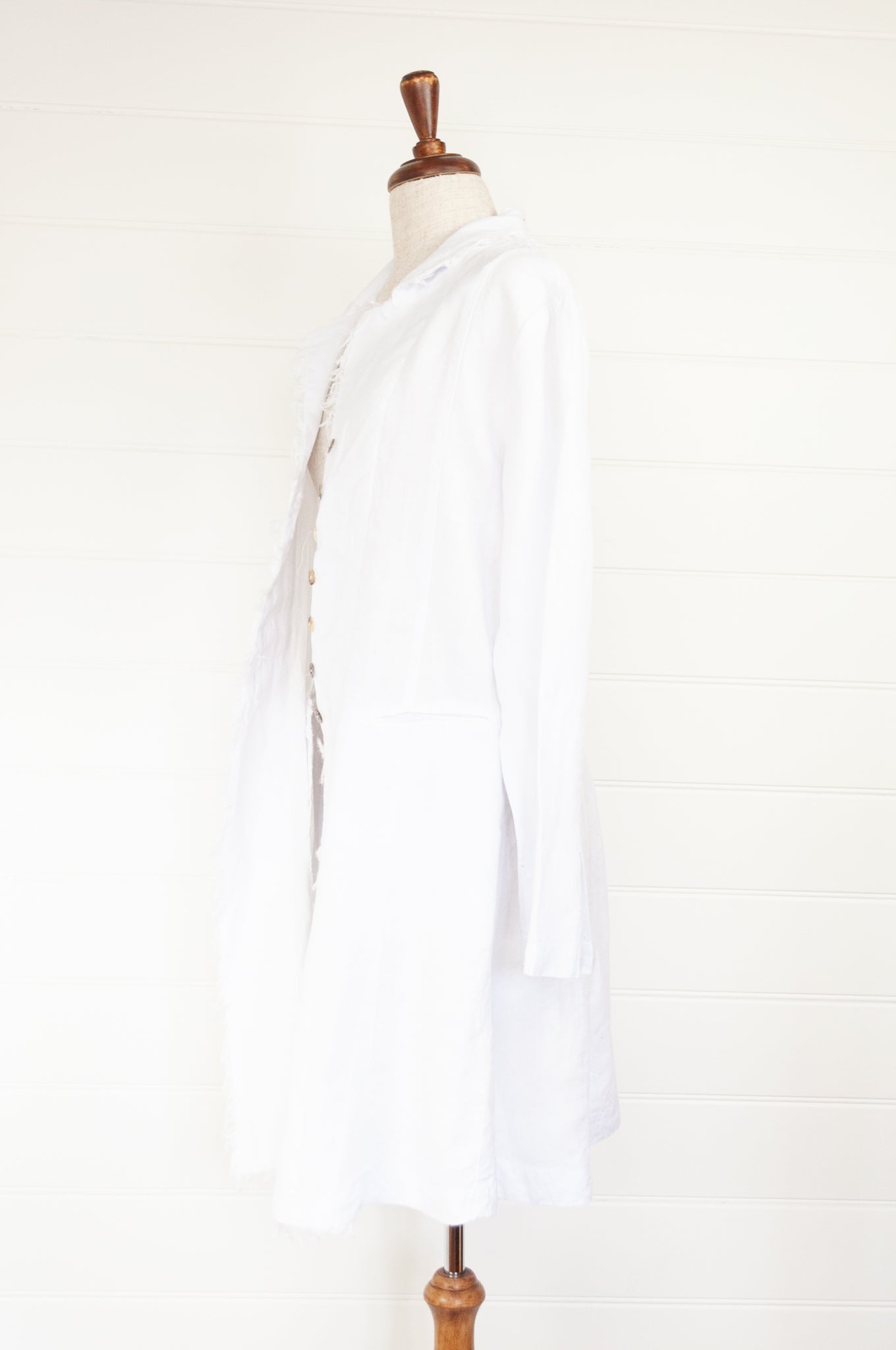 Banana Blue long jacket duster coat in 100% European white linen, long sleeves half button up and fringed edges.
