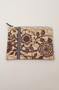 Anna Kaszer Polly pouch, geometric background in beige with yellow detail and brown flower print.