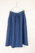 Load image into Gallery viewer, Dve Collection one size 100% linen skirt with elastic and drawstring waist, side pockets. Indigo with fine white stripe.