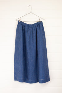 Dve Collection one size 100% linen skirt with elastic and drawstring waist, side pockets. Indigo with fine white stripe.