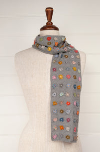 Sophie Digard medium size crochet scarf Ernestine multi colour flowers on a soft sage grey green checkboard base.