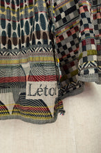 Load image into Gallery viewer, Létol made in France organic cotton jacquard scarf, Germain in Multico, a multicolour palette, black and ecru with highlights in red, mustard, olive and teal.