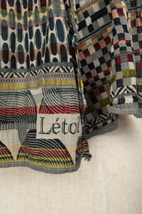 Létol made in France organic cotton jacquard scarf, Germain in Multico, a multicolour palette, black and ecru with highlights in red, mustard, olive and teal.