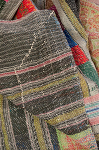 Vintage kantha quilt, heavier weight Mayra, striped patchwork in black and olive green with bright pops of colour, soft vintage green and red floral on reverse.