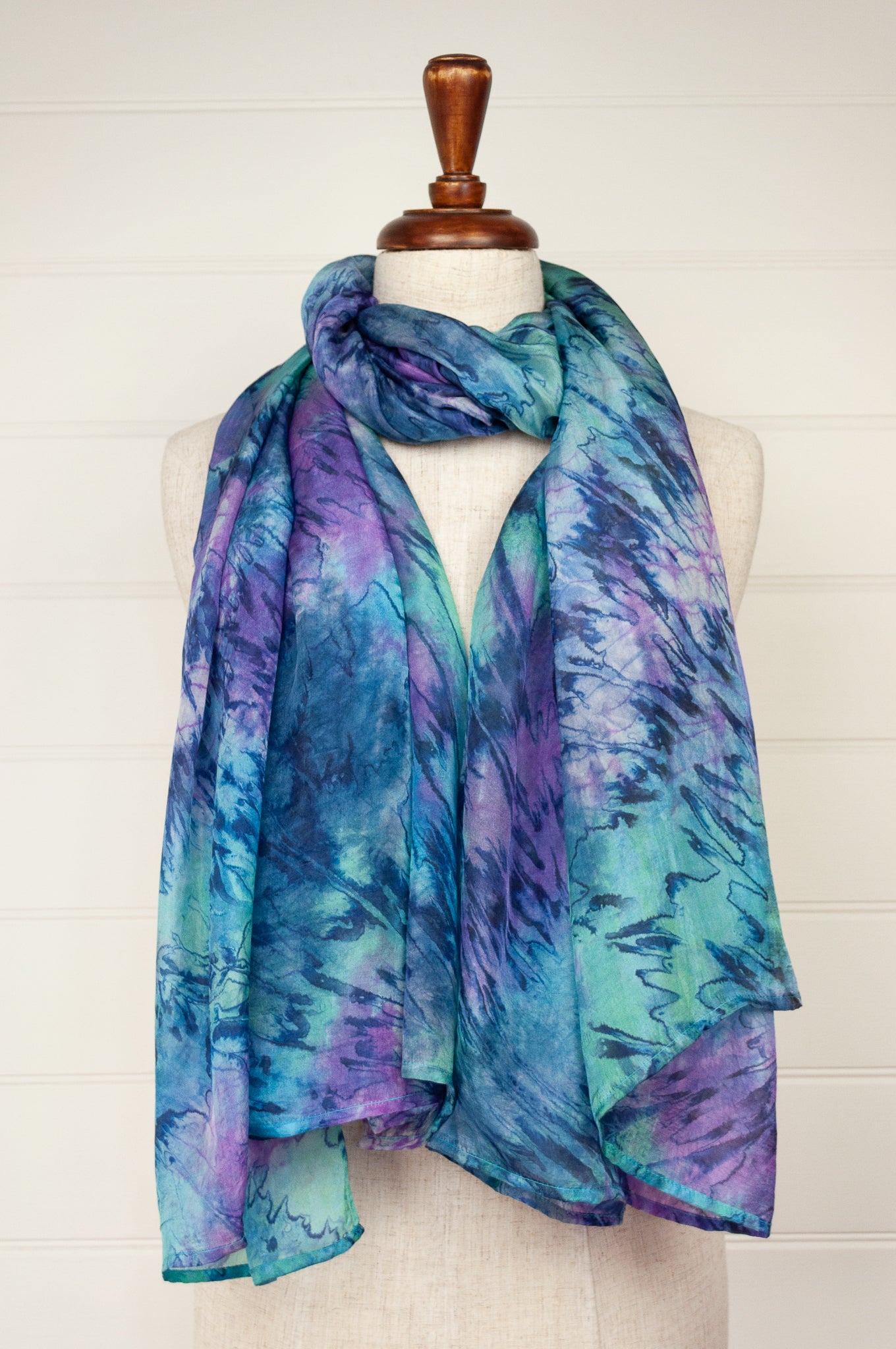 Digitally printed lightweight silk scarf in waterlily, shades of blue, mauve, lavender, aqua and teal.