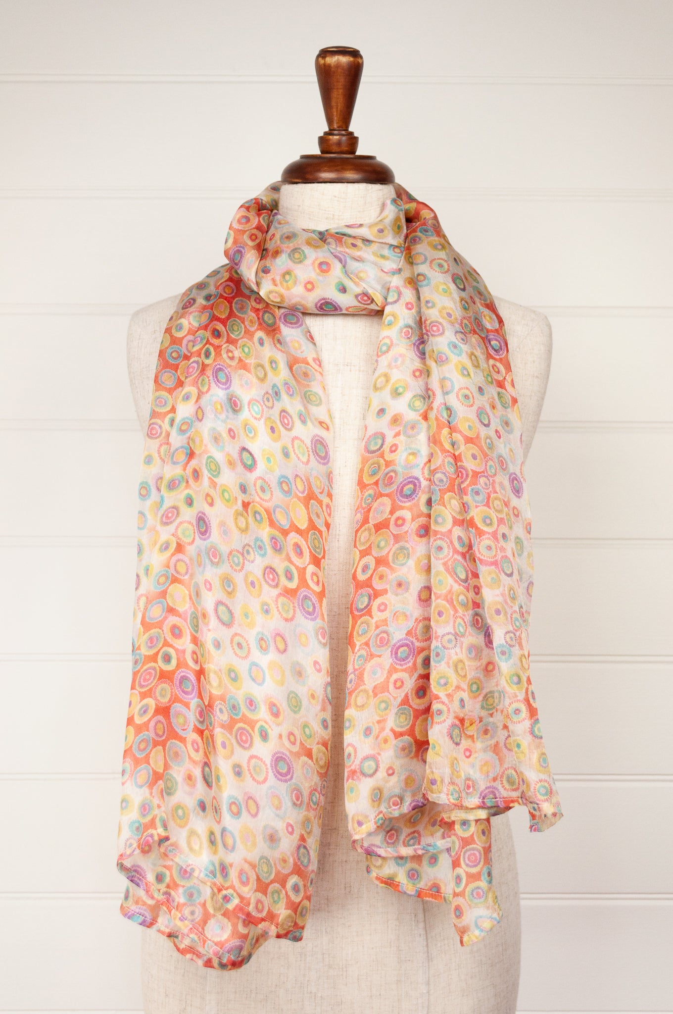 Juniper Hearth silk scarf, digital printed multi colour dots on white, with smudged diamond areas in coral red.