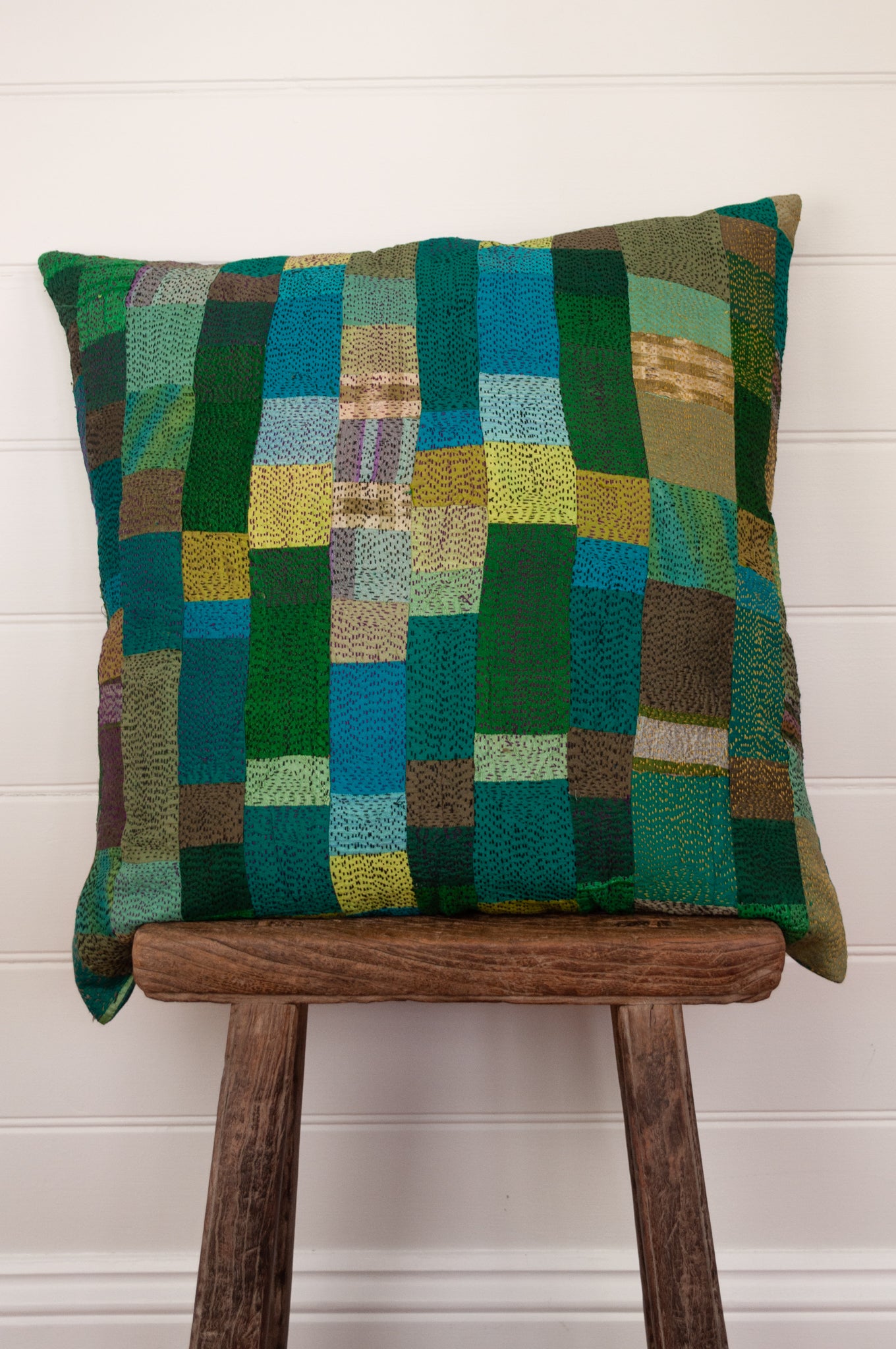 Vintage silk kantha square cushion is in shades of green, aqua, lime and sky blue.
