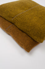 Load image into Gallery viewer, Juniper Hearth baby yak wool poncho in Weed, a deep yellow olive green shade and also in Maize (bottom). Close up, in pouches.