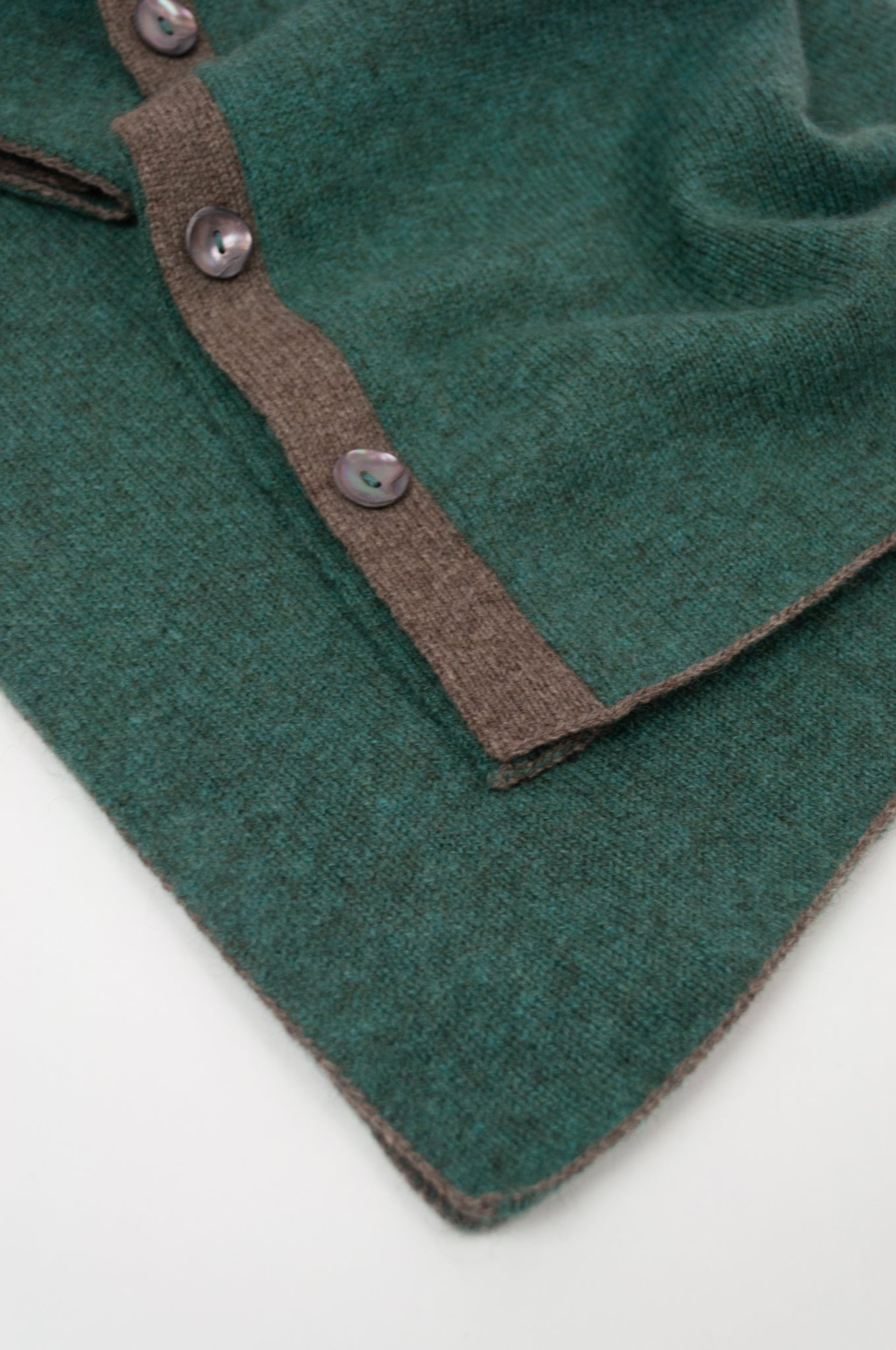 Juniper Hearth baby yak poncho in Opal, a shade of blue green (close up).