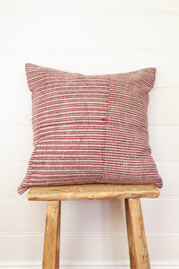 Vintage kantha quilt cushion, overdyed with red and white and black blockprint dotted check pattern.