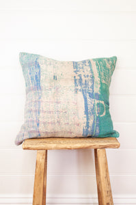 VIntage kantha quilt cushion in shades of mint green, white, blue and lavender.