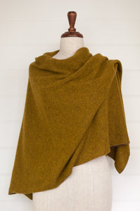 Juniper Hearth baby yak wool poncho in Weed, a deep yellow olive green shade.