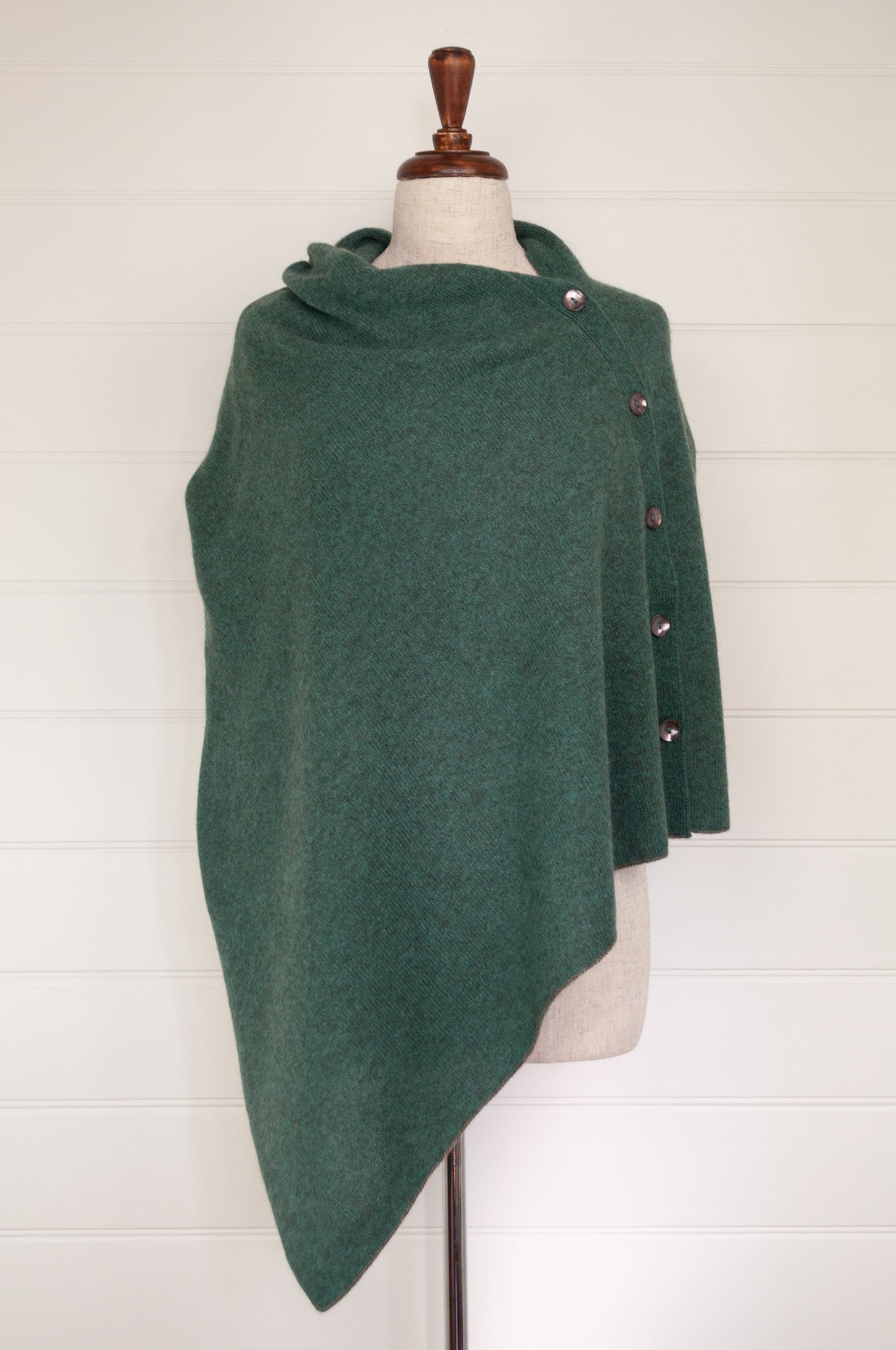 Juniper Hearth baby yak poncho in Opal, a shade of blue green.