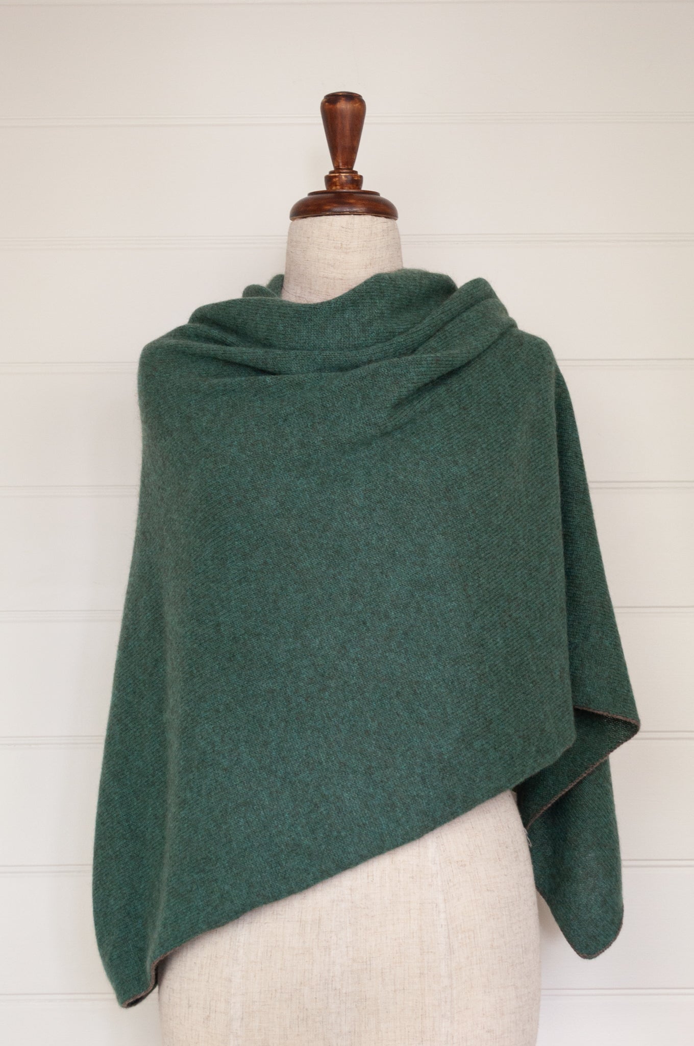Juniper Hearth baby yak poncho in Opal, a shade of blue green.