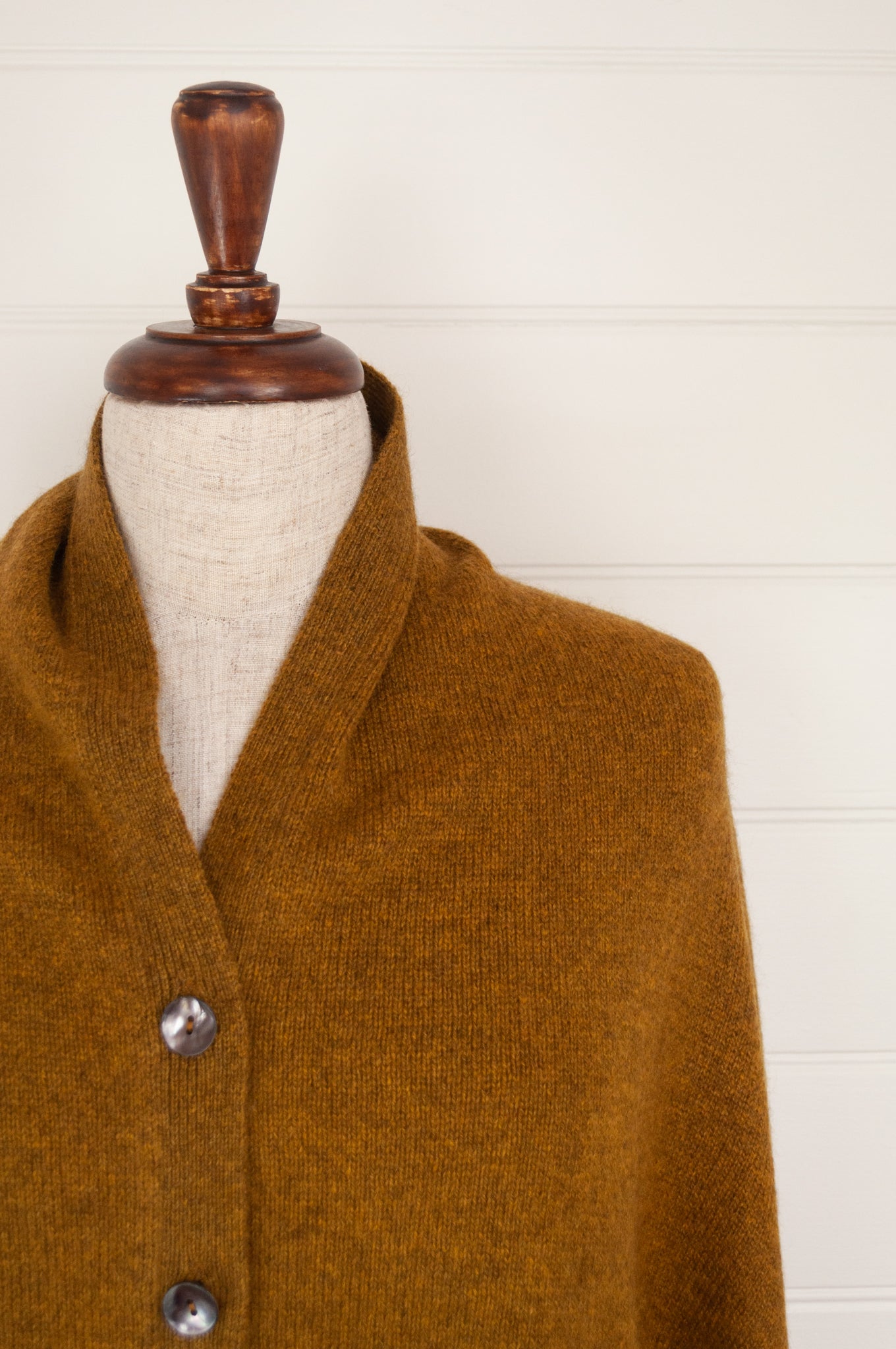 Juniper Hearth baby yak wool poncho in Maize, a deep mustard gold.