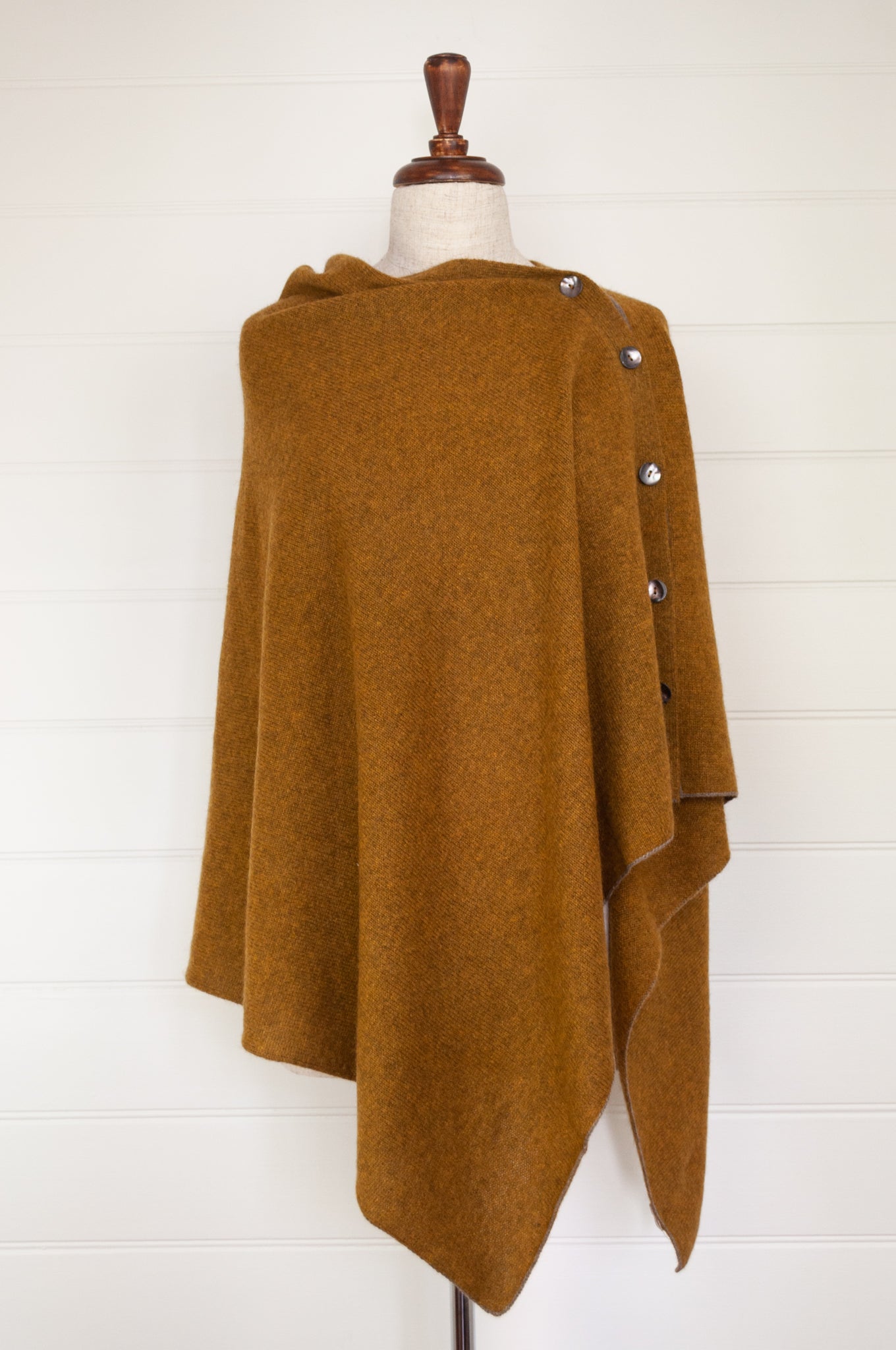 Juniper Hearth baby yak wool poncho in Maize, a deep mustard gold.