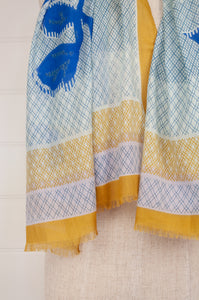 Anna Kaszer designed in Paris, made in India fine cotton voile scarf, large graphic floral adn vine design on soft diamond check background, in cobalt blue, mustard and aqua on white.