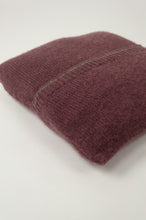 Load image into Gallery viewer, Juniper Hearth baby yak wool poncho in light plum, folded in pouch.