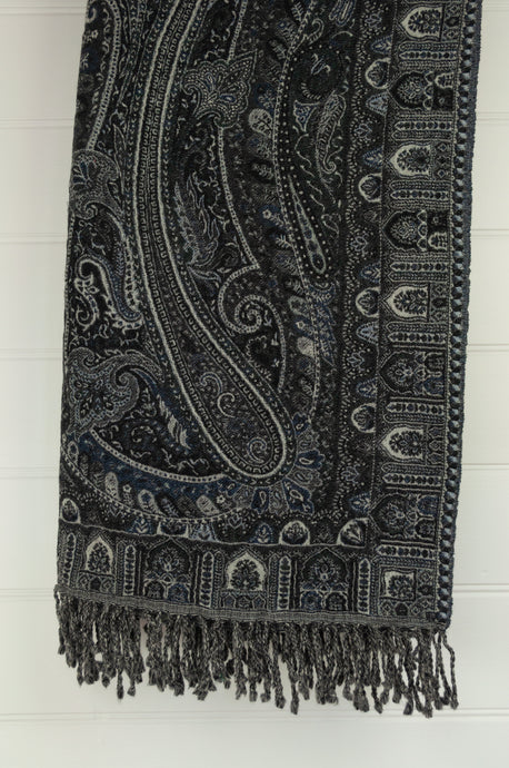 Juniper Hearth pure wool reversible tasseled throw rug with classic paisley design in charcoal, indigo and light grey.