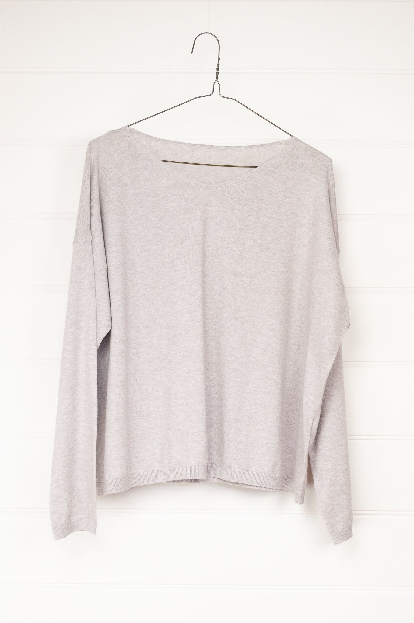 One size slouchy V-neck sweater in cashmere cotton, light ash grey. Ethically made in Nepal.