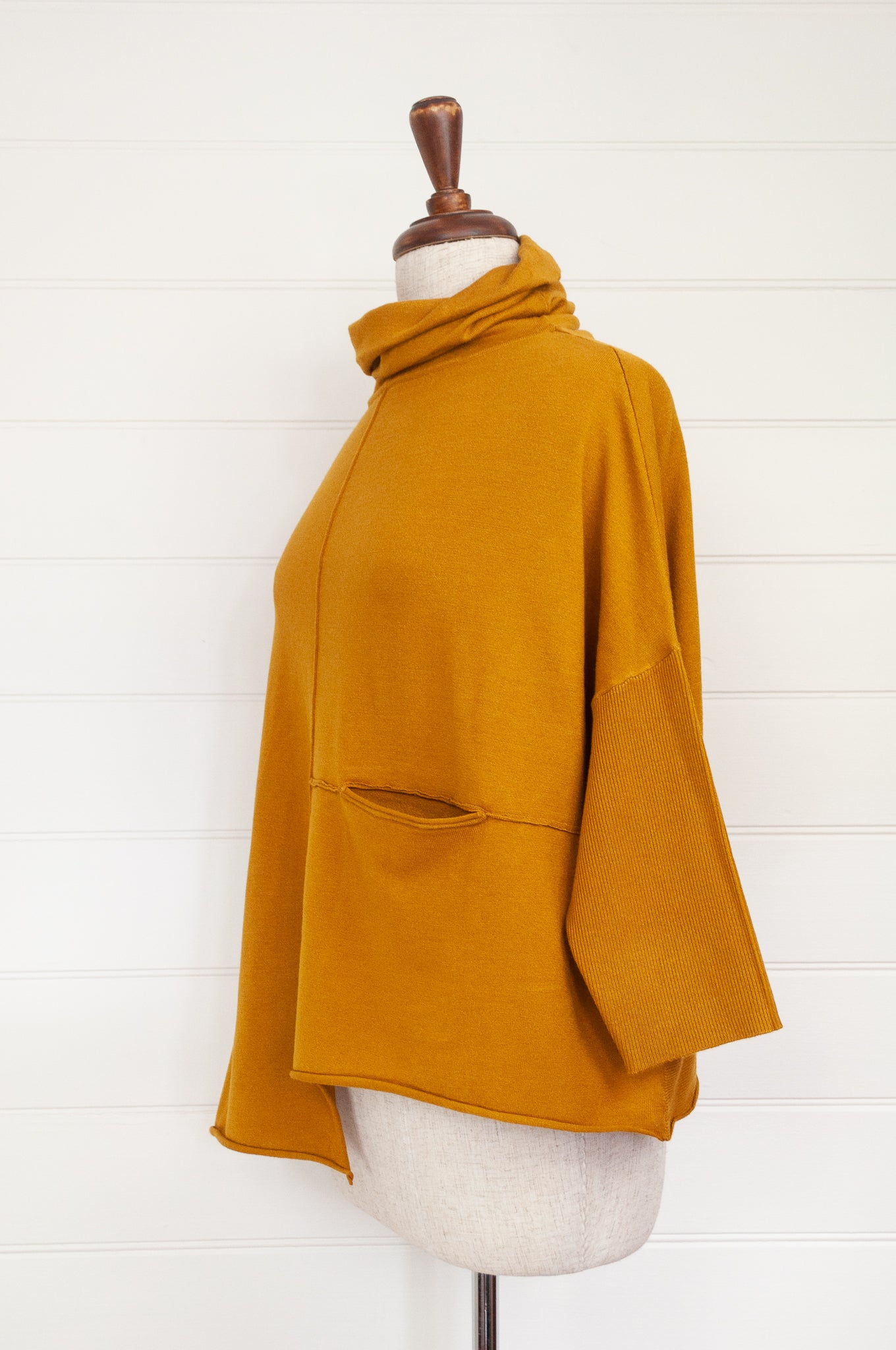 Banana Blue designed in Melbourne box jumper with roll neck in mustard yellow poly voly blend.