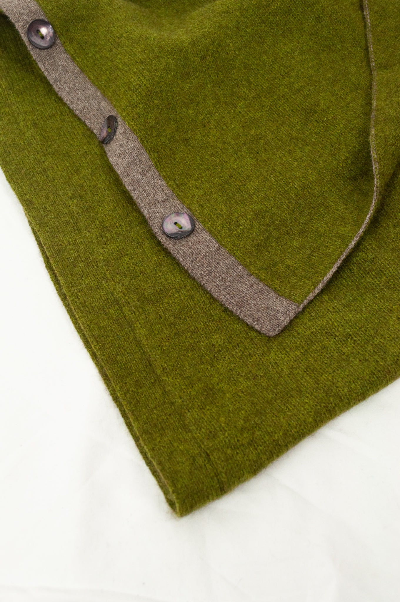 Made in Nepal one size button up poncho in chartreuse green.