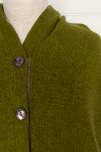 Made in Nepal one size button up poncho in chartreuse green.