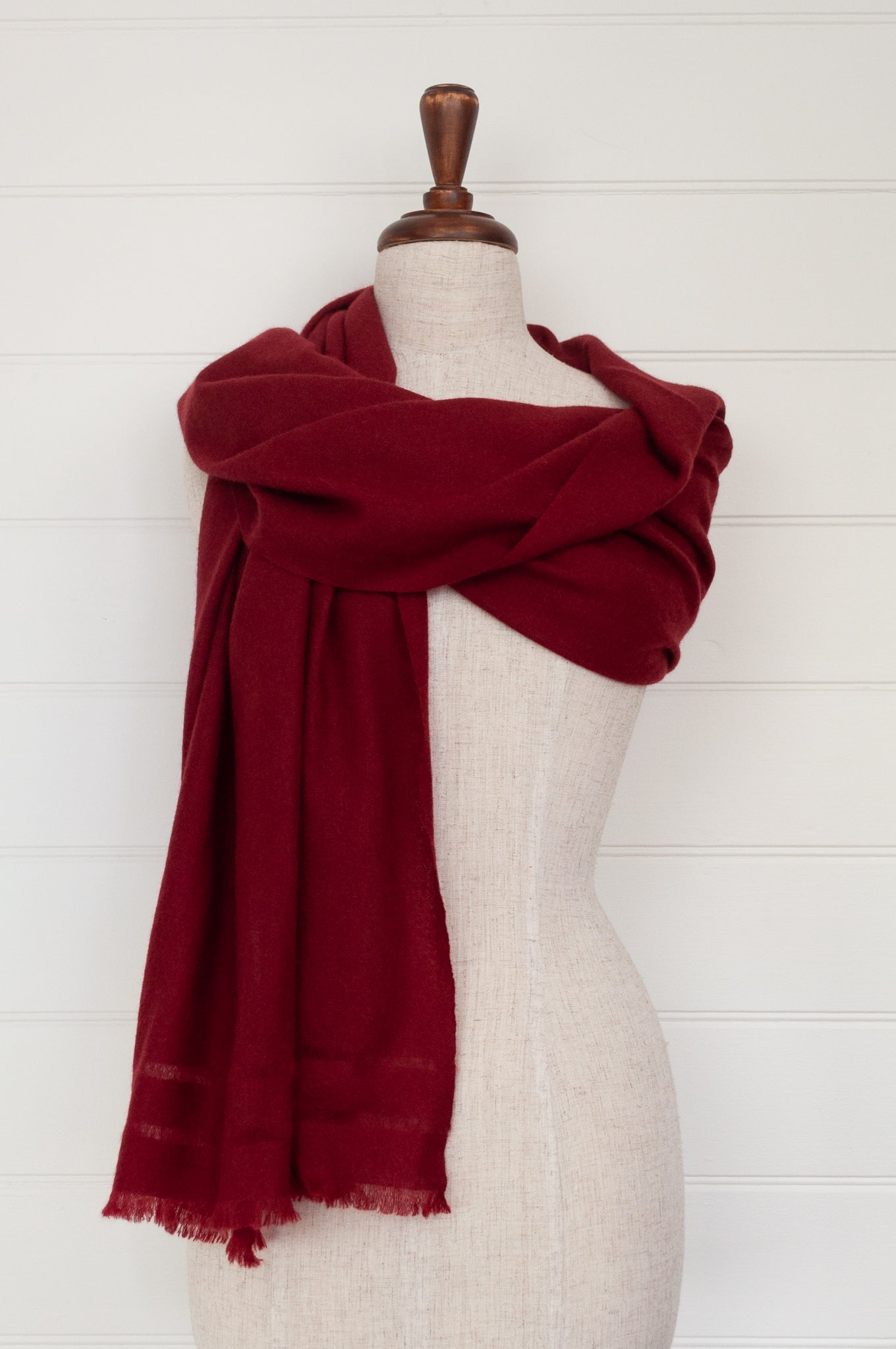 Juniper Hearth woven cashmere scarf featuring fagoting detail and fringed at ends, in cherry red.