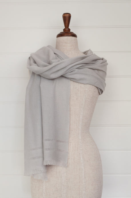 Juniper Hearth woven cashmere scarf featuring fagoting detail and fringed at ends, in silver grey..