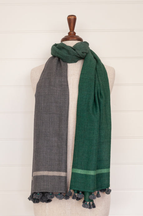 Juniper Hearth woven merino wool scarf, lightweight and very soft, melange dye from charcoal to jade green, with handmade pompoms.