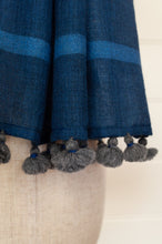 Load image into Gallery viewer, Juniper Hearth woven merino wool scarf, lightweight and very soft, melange dye from charcoal to sapphire blue, with handmade pompoms.
