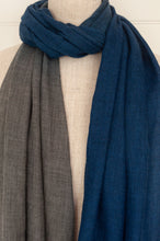 Load image into Gallery viewer, Juniper Hearth woven merino wool scarf, lightweight and very soft, melange dye from charcoal to sapphire blue, with handmade pompoms.