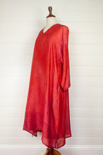Load image into Gallery viewer, Neeru Kumar Petria dress in pink orange vermillion red silk shibori. A-line three quarter sleeve tunic dress  with V-neck includes slip.