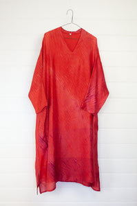 Neeru Kumar Petria dress in pink orange vermillion red silk shibori. A-line three quarter sleeve tunic dress  with V-neck includes slip.