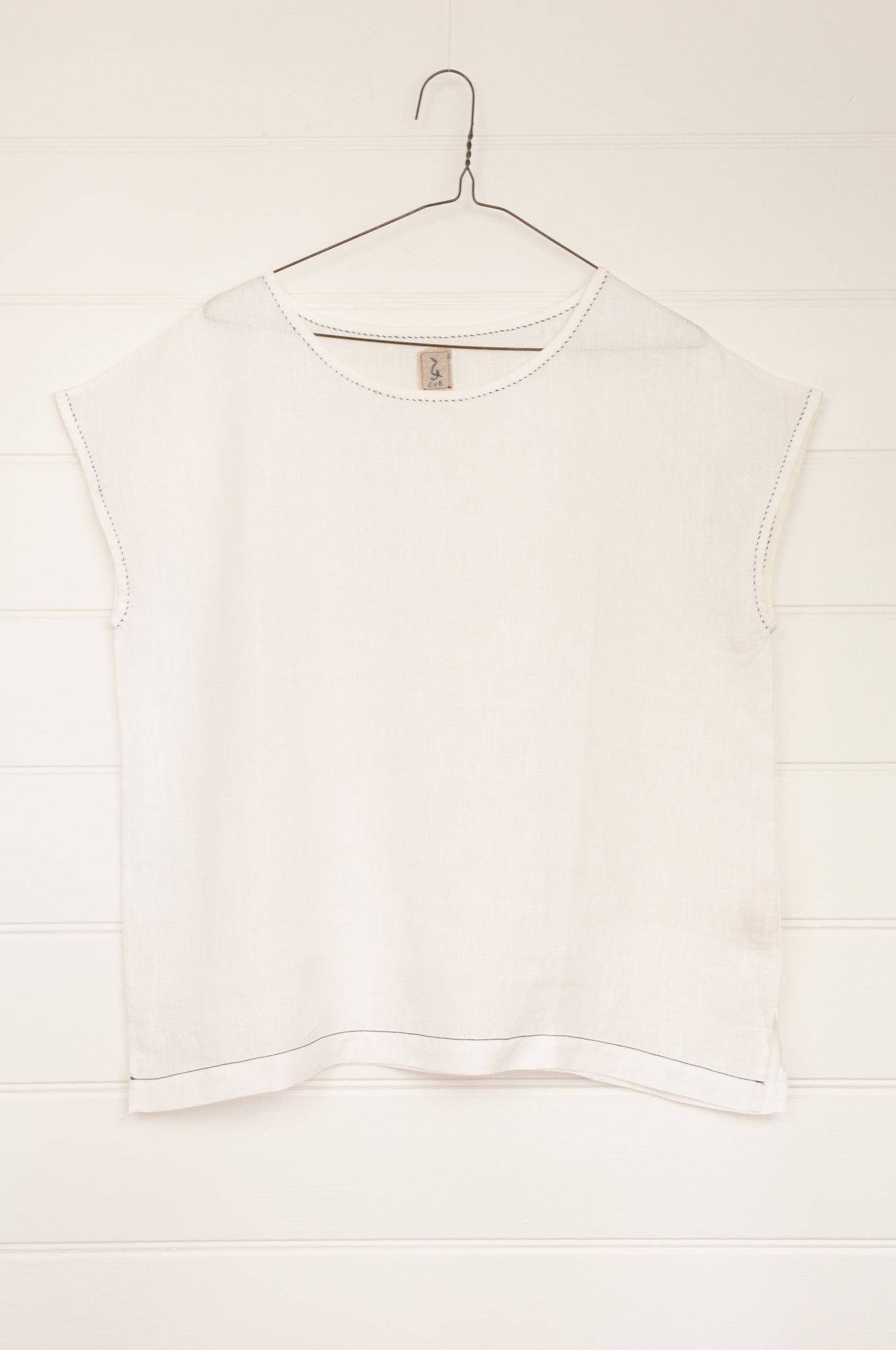 DVE Collection Kriya top in white linen, versatile cap sleeve top.