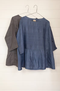 Dve Collection Padma one size top in blue grey pure silk, three quarter sleeves with gathered peplum at front.