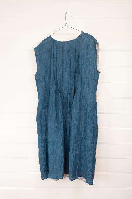Kimberley Tonkin Jo dress in high twist crinkle linen, sleeveless round neck with front pleats, reversible two way in graphite grey and atlantic blue.