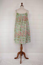 Load image into Gallery viewer, Ethically made pure cotton voile summer nightdress with adjustable straps and pintucked yoke, this nightie is in a mint green floral print with broderie edging (back view).