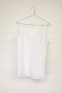 Cotton lace edged white cotton lightweight camisole bias cut with adjustable straps.