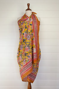 Cotton voile blockprint sarong, colourful floral on mustard yellow.
