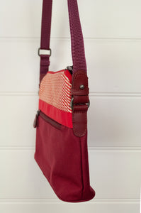 Anna Kaszer Paris Presto bag in Malva, compact size with flat base, red and ecru print print trim on deep red body, adjustable cross border shoulder strap.